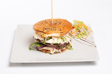 details of tasty beef burger with coleslaw salad on white background