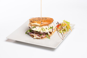 details of tasty beef burger with coleslaw salad on white background