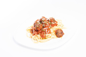 details of tasty fresh spaghetti and meatballs plate, on white background