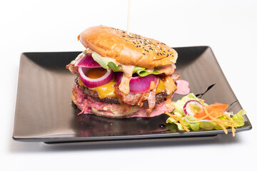 details of tasty beef burger, on a black plate with white background