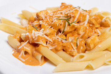 details of tasty fresh restaurant chicken pasta with red sauce