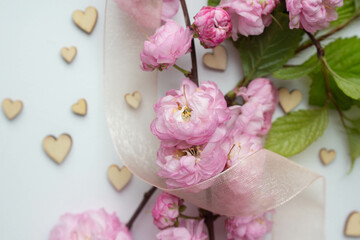 pink spring flowers. sakura. almond flowers with hearts. 14 february