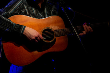 Obraz premium Guitarists playing electric guitars on stage