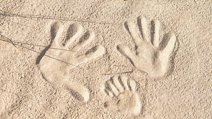 handprints in the sand on the beach of the Baltic Sea.
