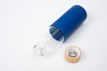 Stylish glass water bottle with wooden lid. For fitness and travel.