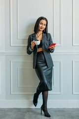 young Asian girl business style clothes, with a laptop