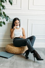 young Asian girl business style clothes, with a laptop