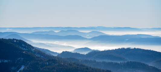 Amazing mystical rising fog mountains sky forest trees landscape view in black forest ( Schwarzwald ) winter, Germany panorama panoramic banner - mystical snow foggy mood - obrazy, fototapety, plakaty