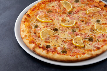 fresh pizza on the white plate