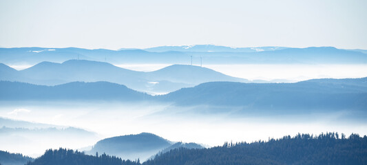 Amazing mystical rising fog mountains sky forest trees landscape view in black forest ( Schwarzwald...