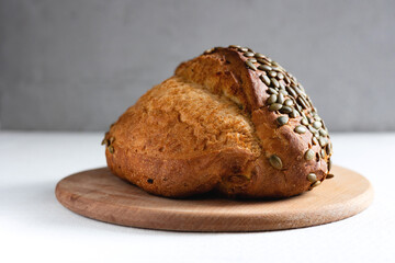Rye bread on a board on a white tablecloth background