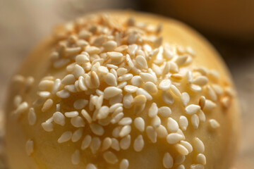 Hamburger bun with sesame seeds Shallow depth of field.
