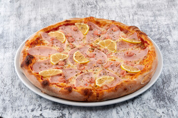 fresh pizza on the white plate