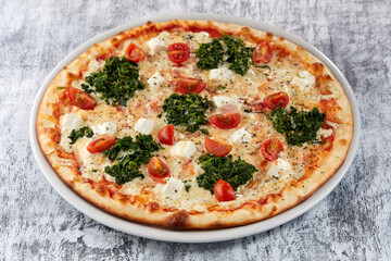 fresh pizza on the white plate