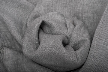 Linen texture, cloth background, folds and fiber from above. Wrinkled linen cloth folded napkins. Linen fabric texture. Concept of using natural eco-friendly materials
