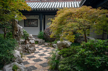 chinese garden with stone house