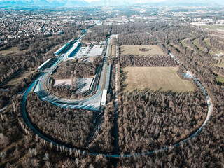 Aerial view of The Autodromo Nazionale of Monza, that is a race track located near the city of Monza, north of Milan, in Italy. Drone photography of the circuit in Monza, Lombardia, Brianza. - obrazy, fototapety, plakaty