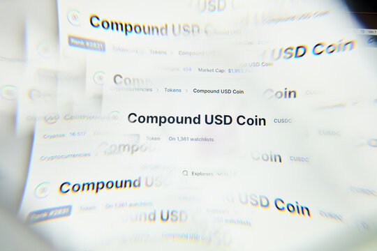 Milan, Italy - January 11, 2022: compound - COMP logo on laptop screen seen through an optical prism. Dynamic and unique image form compound, COMP coin website. Illustrative editorial.