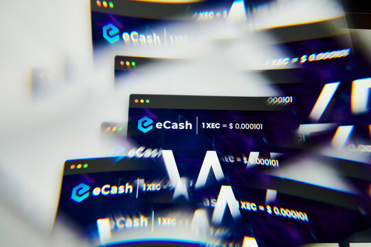 Milan, Italy - January 11, 2022: ecash - XEC logo on laptop screen seen through an optical prism. Dynamic and unique image form ecash, XEC coin website. Illustrative editorial.