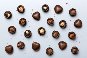 Different kinds of chocolates on colored table close-up. Top View and Flat Lay