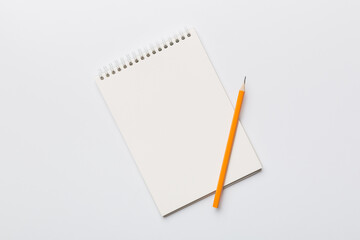 Blank notebook with pen on white background. Back to school and education concept