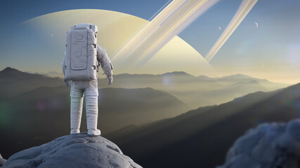 astronaut looking over the landscape from the surface of the moon Titan © dottedyeti