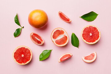 fresh Fruit grapefruit with Juicy grapefruit slices on colored background. Top view. Copy Space....