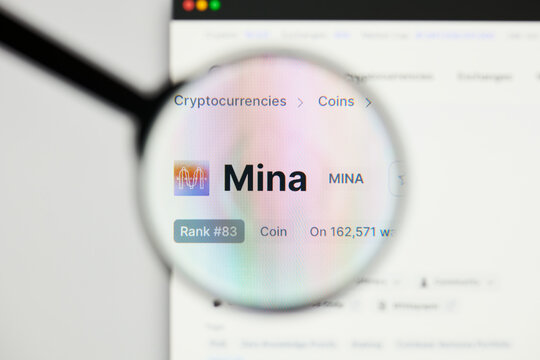Milan, Italy - January 11, 2022: mina protocol - MINA website's hp.  mina protocol, MINA coin logo visible through a loope. Defi, ntf, cryptocurrency concepts illustrative editorial.