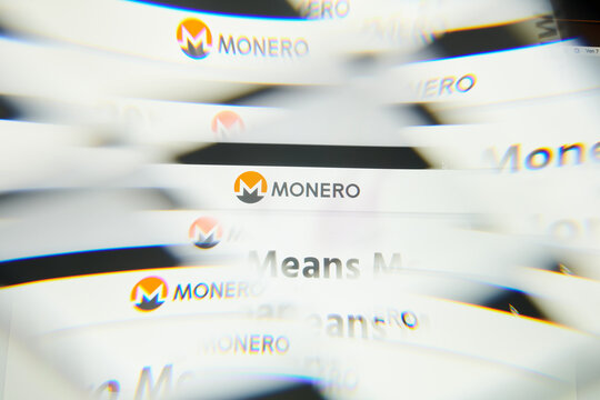 Milan, Italy - January 11, 2022: monero - XMR logo on laptop screen seen through an optical prism. Dynamic and unique image form monero, XMR coin website. Illustrative editorial.