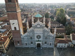 Fototapeta premium Aerial view of facade of the ancient Duomo in Monza (Monza Cathedral). Drone photography of the main square with church in Monza in north Italy, Brianza, Lombardia.