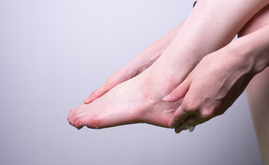 Fototapeta na wymiar Washing your feet. Foam feet. Wash your feet with soap