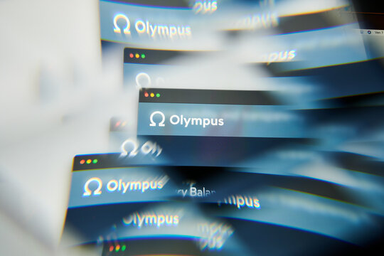 Milan, Italy - January 11, 2022: olympus - OHM logo on laptop screen seen through an optical prism. Dynamic and unique image form olympus, OHM coin website. Illustrative editorial.
