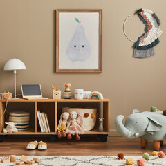 Stylish scandinavian kid room interior with toys, teddy bear, plush animal toys, mint armchair, furniture, decoration and child accessories. Brown wooden mock up poster frames on the wall. Template