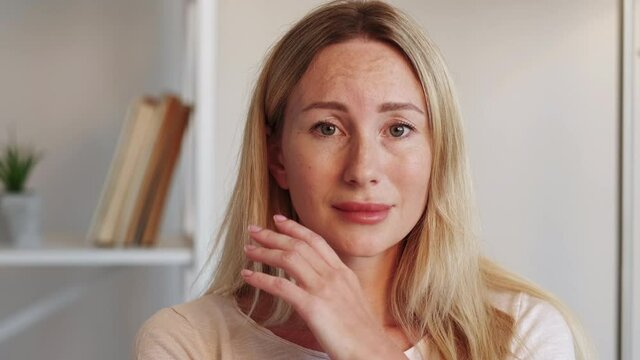 Upset woman. Disappointment regret. Lost hope. Crying lady feeling sad sitting in light room interior.