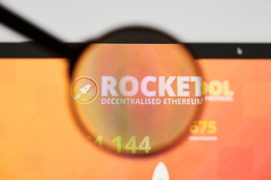 Milan, Italy - January 11, 2022: rocket pool - RPL website's hp.  rocket pool, RPL coin logo visible through a loope. Defi, ntf, cryptocurrency concepts illustrative editorial.