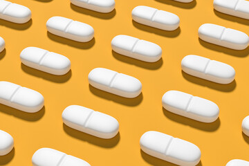 White realistic tablets with texture and shadows on a yellow background of sunlight. Background pattern. 3D rendering.