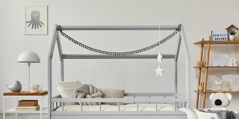 Stylish scandinavian child's room with creative wooden bed, wooden cube, lamp, wooden shelf, plush...
