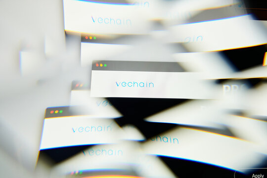 Milan, Italy - January 11, 2022: vechain - VET logo on laptop screen seen through an optical prism. Dynamic and unique image form vechain, VET coin website. Illustrative editorial.