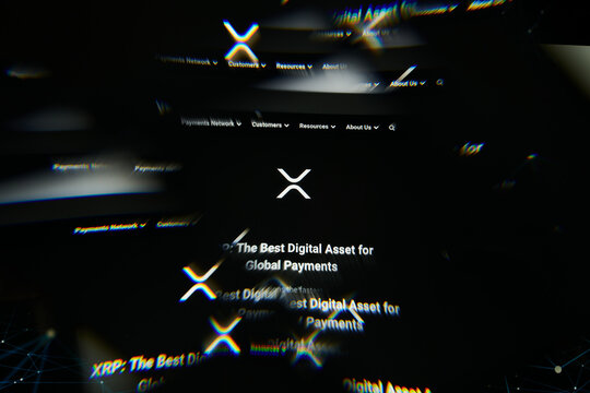Milan, Italy - January 11, 2022: xrp - XRP logo on laptop screen seen through an optical prism. Dynamic and unique image form xrp, XRP coin website. Illustrative editorial.