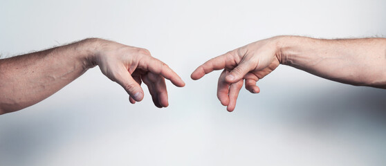 Two male hands posing like Da Vinci Creation of Adam masterpiece - obrazy, fototapety, plakaty