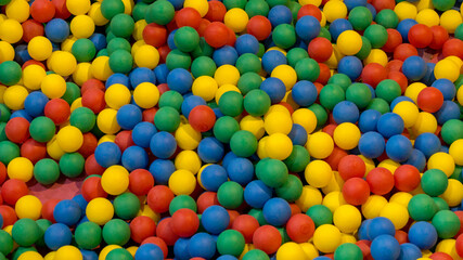A colorful and well-groomed children's ball pit in a play park