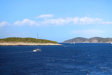 Fototapeta na wymiar Sailing boat and beautiful Adriatic sea landscape in Croatia. 