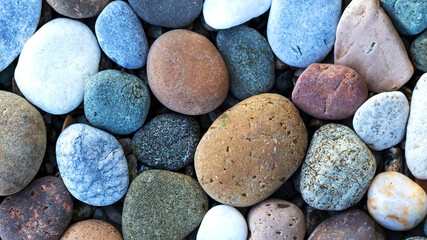 Round colorful stones on the bank of Baikal lake.