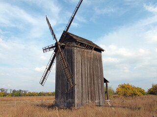 Fototapeta na wymiar Ancient Cossack mill in southern Khortytsia on a background of sunny barely cloudy sky.