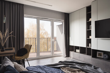 Bright bedroom with window wall