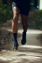 Fototapeta na wymiar Close up of legs of black guy running