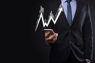 Businessman hold sales data and economic growth graph chart. Business planning and strategy. Analysing trading of exchange. Financial and banking. Technology digital marketing.Profit and growing plan.