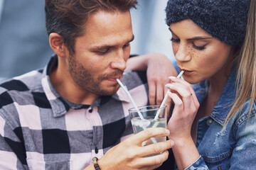 Young nice couple having fun on camping sharing drink