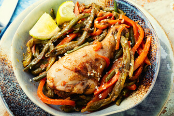 Chicken legs stewed with spices and vegetables.