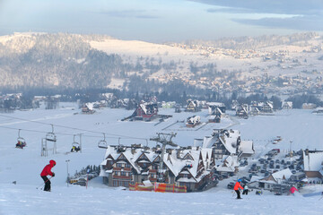  Ski lift and the ski slope in popular winter resort Kotelnica Bialczanska.